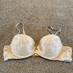 Adore Me cream and light grey lacey bra